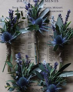 blue flowers and greenery are arranged on top of an old book page with the words dance in my moments