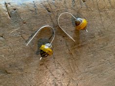 Mustard Yellow Silver Earrings, Boho Short Dangle Earrings, Handforged Sterling Ear Wires, Gifts under 25.00 for women, her Unique mustard and brown swirl Czech glass set upon my hand-forged sterling ear wires. I have hammered the torch balls at the wire's end for artistic flair! Earring length is 1/2 inch and total drop length from top of wire is 1 inch. This mustard is my favorite color of yellow-muted but eye-catching. Simple and arty in the perfect colors for fall. ------BACK to shop: https: Yellow Bohemian Earrings For Summer, Yellow Bohemian Resizable Jewelry, Bohemian Yellow Sterling Silver Jewelry, Adjustable Yellow Bohemian Earrings, Yellow Bohemian Metal Earrings, Vine Wedding Ring, Birthstone Jewelry Mothers, Nature Inspired Wedding Ring, Bracelet Quotes