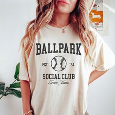 Show your team spirit with our Custom Baseball Mom Shirt, crafted for comfort and style in the classic Comfort Colors Ballpark Social Club design! Perfect for baseball season, this personalized Sports Mom Tee makes an ideal gift for any dedicated sports mom! 🤍 ♥ DESCRIPTION: This is a Comfort Colors Unisex t-shirt that is 100% ring-spun cotton, soft-washed, garment-dyed fabric brings extra coziness to your wardrobe while the relaxed fit makes it an excellent daily choice. The double-needle stit Collegiate Sports Top With Custom Logo, Collegiate Pre-shrunk Baseball Jersey For Sports Season, College Sports Fan Baseball Jersey With Letter Print, Game Day Cotton Baseball Jersey With Team Logo, Collegiate Style Baseball Jersey With Crew Neck, Collegiate Style Crew Neck Baseball Jersey For Sports Season, Sporty Short Sleeve Baseball Jersey For Fans, Team-colored Cotton Baseball Jersey For Sports Fans, Collegiate Baseball Jersey With Crew Neck For Sports Season