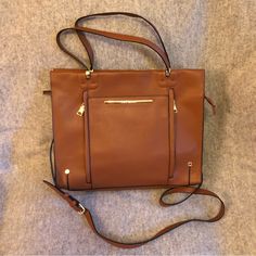 Make An Offer! This Steve Madden Tote Is Perfect For Office/Work. Brand New, Never Used Nutmeg Brown Faux Pebbled Leather Bag Features Secure Zip Closure At Top, Top Handles, And Removable And Adjustable Shoulder/Cross-Body Strap. Two (2) Main Inside Compartments: One W/ 2 Small Pockets For Pens, Phone, Etc. + 1 Slim Zip Pocket; One W/ Slim Zipper Pocket. Front Features 3 Slim External Pockets (2 W/ Zippers). Easily Fits Laptop And So Much More! Excellent Condition. Note: One Minor Flaw. Small H Brown Shoulder Bag With Zipper For Work, Brown Zipper Closure Shoulder Bag For Work, Brown Satchel With Zipper Closure For Work, Brown Satchel With Zipper For Work, Steve Madden Bags, Top Top, Office Work, Tan Brown, Pebbled Leather