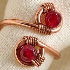 Symbolizing balance and harmony, agate stones also add a classy touch of regal red to this beautiful statement ring. Fashioned from thick copper wire that wraps around two agate stones, this adjustable ring will be one you reach for again and again. Handcrafted in Chile, this piece is a Ten Thousand Villages Exclusive. Balance And Harmony, Wrap Ring, Ten Thousand, Wrap Rings, Agate Stone, Adjustable Ring, Adjustable Rings, Statement Ring, Copper Wire