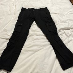 32/34 Never Worn Black Cargo Pants Black Stretch Cotton Cargo Jeans, Black Stretch Urban Cargo Pants, Black Fitted Cargo Bottoms, Black Stretch Cargo Pants Urban Style, Black Stretch Cargo Pants For Urban Style, Black Stretch Straight Leg Cargo Jeans, Fitted Black Cargo Bottoms, Black Stretch Bottoms With Multiple Pockets, Stretch Black Bottoms With Multiple Pockets