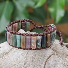 Designed with a rainbow of earthy colors, Sareeyakarn's wristband bracelet is a true delight for jewelry lovers everywhere. The Thai artisan uses waxed polyester cord to hand knot the macrame bracelet, fitting agate gemstones and reconstituted turquoise gemstones between the dark brown cords. Gemstone Bangle, Wristband Bracelet, Macrame Bracelet, Macrame Bracelets, Earthy Colors, Agate Gemstone, Turquoise Gemstone, Jewelry Lover, A Rainbow