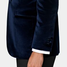 This navy dinner jacket is cut to a tailored fit, providing a slim chest and waist for a fitted silhouette and a natural shoulder design. It features a straight peak lapel, jetted pockets, and a half-canvas construction. Semi-formal Double-breasted Sport Coat With Concealed Placket, Luxury Slim Fit Long Sleeve Blazer, Luxury Notch Lapel Slim Fit Blazer, Luxury Slim Fit Notch Lapel Blazer, Luxury Fitted Tuxedo With Double Button Closure, Luxury Slim Fit Blazer With Notch Lapel, Fitted Double-breasted Sport Coat With Concealed Placket, Evening Suit With Double Button Closure And Notch Lapel, Slim Fit Notch Lapel Sport Coat For Semi-formal Occasions