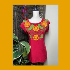 "A very nice and beautiful Sunflower Blouse w/Gorgeous Embroidery. The design work is simply gorgeous. Perfect for your ultimate weekend look, beach, casual look or just to impress your friends with this gorgeous piece. You will Love it! Blouse STYLE DETAILS Overview * Round neck * Handmade work * 3/4 Long sleeves * 22\" UNDERARM TO UNDERARM, 30.5\" SHOULDER TO HEM fabric & care * hand wash * delicate care * hang dry Please email me your questions before buying email me TODAY All of my items Vibrant Cotton Summer Tops, Floral Print Crew Neck Blouse For Beach, Casual Red Embroidered Short Sleeve Top, Embroidered Summer Beach Blouse, Summer Blouse With Floral Embroidery And Short Sleeves, Cotton Crew Neck Beach Blouse, Red Bohemian Crew Neck Blouse, Crew Neck Cotton Blouse For Beach, Crew Neck Cotton Blouse For The Beach