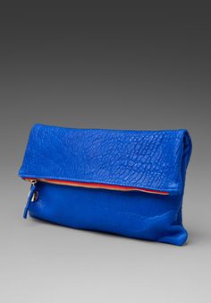 Foldover clutch in blue pebbled leather, Claire Vivier, RevolveClothing.com, $143 Blue Leather Bag, Blue Handbag, Clare Vivier, Foldover Clutch, Blue Clutch, Clare V, Revolve Clothing, Blue Bags