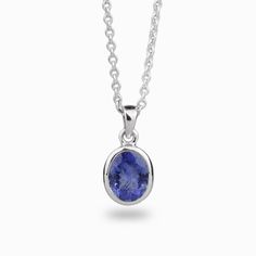 A delicate balance of rich blue and violet, this gem has fine crystal inclusions and an exquisite luster. Wearing this deep blue-hued beauty will add an elegant touch to any outfit. Known as the ‘stone of magic’ it brings its wearer the confidence to turn ideas into reality. Bringing the “will” to start and enhances from beginning to the end. This stone is also great for Communication and Protection. Stone Origin: ﻿Tanzania Please Note: All pieces shipped within 48 hours from our Del Mar Gallery Formal Blue Sapphire Necklace, Classic Oval Tanzanite Necklaces, Formal Blue Tanzanite Gemstones, Classic Oval Tanzanite Necklace, Formal Sapphire Round Pendant Necklace, Elegant Blue Tanzanite Gemstones, Faceted Tanzanite Jewelry For Gifts, Faceted Tanzanite Jewelry Gift, Formal Sapphire Gemstone Necklace