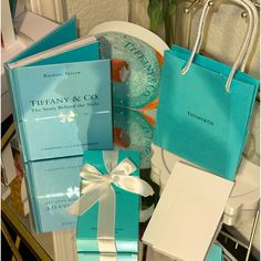 there are many blue and white items on the table together, such as a gift bag