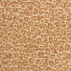 an orange and beige background with small spots on the fabric, which is very soft