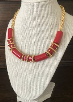 This is a vintage Goldtone and Red Enamel Link Bib Choker Necklace. It measures 17 1/2 inches in length and 1/2 inch wide. This necklace is made of Goldtone Metal with Red Enamel Sections or Links with Goldtone Stars and Braiding And Goldtone Chain with a Lobster Clasp. It is a Well-Constructed Necklace, in excellent condition. Red Handmade Enamel Necklaces, Handmade Red Enamel Necklaces, Handmade Red Enamel Necklace, Vintage Red Necklace With Lobster Clasp, Handmade Red Necklaces For Collectors, Red Handmade Necklace For Collectors, Red Vintage Necklace For Collectors, Pink Quartz Jewelry, Art Deco Bracelet