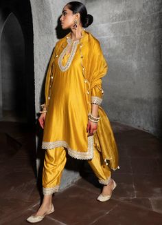 Elevate your ethnic wardrobe with the Mango Yellow Scallop Kurta Set. This dreamy ensemble features shimmering metallic zari and sequins, delicately embellished on the neck, sleeves, and borders of the kurta. The festive scallops on the dupatta are adorned with ivory shells and coins, adding a touch of elegance to your look. Embrace the beauty of tradition with this stunning kurta set that effortlessly combines style and sophistication. Perfect for Mehendi or Puja Composition : Kurta and Bottoms Scallop Kurta, Mango Yellow, Chanderi Dupatta, Kurta Set For Women, Vacuum Storage, Bride Sister, Embroidered Pants, Indian Wedding Wear, Innovative Fashion