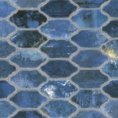 blue glass mosaic tiles are shown in an image that looks like they could be used as wallpaper