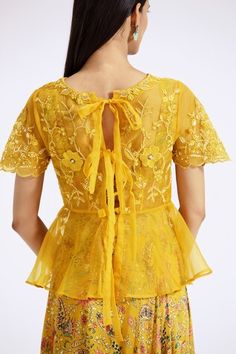 Yellow peplum top with thread embroidered floral patterns highlighted by pearls. Comes with inner bustier and floral paisley pattern skirt. - Aza Fashions Fitted Tops For Spring Reception, Spring Reception Fitted Blouse, Yellow Top For Spring Wedding, Yellow Spring Wedding Top, Elegant Embroidered Yellow Top, Elegant Yellow Embroidered Top, Summer Reception Blouse With Floral Embroidery, Floral Peplum Top, Top Skirt Set