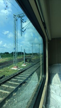 the view from inside a train looking at railroad tracks