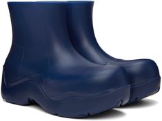 Ankle-high waterproof biodegradable rubber boots in blue. · Bonded jersey lining · Textured rubber midsole · Treaded rubber outsole Supplier color: Cruise Blue Waterproof Boots For Rainy Weather, Blue Weatherproof Boots For Rainy Weather, Weatherproof Blue Boots For Rainy Weather, Blue Round Toe Rain Boots, Blue High-top Waterproof Boots, Puddle Boots, Rubber Boots, Bottega Veneta, Rubber Rain Boots