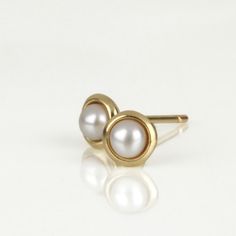 small #gold #earrings with white #pearls, a touch of softness, earrings you will enjoy wearing all day long for many years.  by #SigalGerson Hypoallergenic 14k White Gold Pearl Earrings, Hypoallergenic White Gold 14k Pearl Earrings, Classic Yellow Gold Pearl Earrings As Gift, Classic Yellow Gold Pearl Earrings For Gift, Classic 14k Gold Pearl Earrings Gift, White Gold Pearl Charm Earrings In 14k, Minimalist Yellow Gold Pearl Earrings For Anniversary, Minimalist Yellow Gold Pearl Earrings, 14k Yellow Gold Pearl Earrings For Anniversary