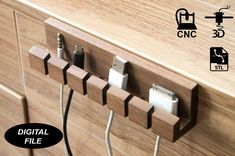 an electrical device is plugged in to a wooden charging station with multiple cords attached