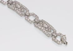 Art Deco Platinum Marquise Brilliant Cut Diamond Bracelet Luxury Vintage Diamond Bracelet For Gift, Luxury Vintage Bracelets With Diamond Hour Markers, Art Deco Diamond Bracelet In Silver, Art Deco Diamond Accented Bracelet, Art Deco Silver Diamond Bracelets, Art Deco Silver Diamond Cut Bracelet, Luxury Victorian Diamond Bracelets, Luxury Art Deco Diamond Bracelet, Diamond Stacks