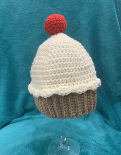 "-Adorable cupcake beanie for toddlers -Can make in any color -Perfect birthday hat  -Crocheted sprinkles can be added to the hat at no additional cost -Hat measures 8\" wide at brim by 6.5\" from brim to top of hat not including additional 2\" for cherry -Made of soft acrylic yarn" Cute Cream Knitted Hats, Cute White Crochet Hat As Gift, Cute White Crochet Hat For Gifts, Cute White Crochet Hat For Gift, Playful White Yarn Hat, Cute One Size Fits Most Brimmed Crochet Hat, White Crochet Hat As A Gift, Cute Crochet Mini Beanie Hat, Cute Crochet Beanie Mini Hat