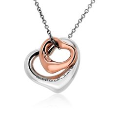 This is part of Chairish’s Fine Jewelry assortment.  Elevate your style with the timeless elegance of the Tiffany & Co. Double Open Heart Necklace. Crafted with precision and love, this exquisite piece combines the warmth of rose gold and the sophistication of silver to create a stunning visual contrast. With two open heart pendants, each measuring 0.50 inches and 0.55 inches, this necklace is a symbol of love, connection, and grace.  Signed: Tiffany & Co Elsa Peretti 750 SPAIN This necklace is Tiffany And Co Necklace, Open Heart Necklace, Heart Necklaces, Tiffany Necklace, Love Connection, Vintage Tiffany, Heart Pendants, Elsa Peretti, Rose Gold Heart