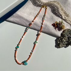 Handmade By Penelope’s Dezines Artisan Jewelry Created To E L E V A T E Your >> Personal Adornment << & A C C E N T U A T E Your >> Natural Beauty << A Coastal Dream. Step Into Your Eternal Summer Era With This Bright And Fresh Necklace. Features Seed Beads In A Vivid Coral Color, With An Intentional Bouncy Pattern Of Teal Blues, White, Sea Foam Green, Gold, And Peachy Pink. Includes Shell, Agate, And Czech Glass. Made With Nylon Coated Stainless Steel Tiger Tail Cord Gold Plated Lobster Clasp A Summer Era, Coral And Teal, Ceramic Pendant Necklace, Handmade Jewelry Business, Tiger Tail, Blue Stone Pendant, Coastal Summer, Shell Beads Necklace, Cameo Pendant Necklace