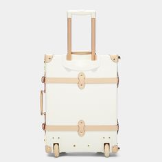 This white leather vintage-inspired cabin luggage will glide gracefully through the openings that mark your path while refining your look from door to door. Its crisp white and tan body opens to lift your spirits with a botanical print of foliage, flowers and birds. This cabin-size luggage boasts the modern amenities of an extendable trolley handle, buckled leather straps, two TSA-approved locks, and two silent-glide wheels for elegant mobility. Inside zippered lid pockets and a detachable door- Luxury Elegant Double Handle Luggage, Classic Luggage With Double Handle, Classic Luggage With Leather Handles, On-the-go Rectangular Luggage With Leather Handles, On-the-go Luggage With Zipper Closure And Double Handle, Cabin Luggage, Tan Body, Tsa Approved, Botanical Print