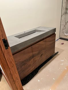 an unfinished bathroom with a sink and counter top in the process of being installed on the floor