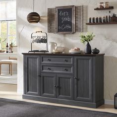 a gray buffet table in a white room