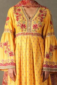 Yellow anarkali with all-over floral prints, embroidered yoke and sleeves. Comes with contrast floral embroidered dupatta and striped pant. - Aza Fashions Floor-length Sharara With Embroidered Border For Eid, Festive Anarkali Palazzo Set With Embroidered Border, Eid Floor-length Sharara With Embroidered Border, Eid Embroidered Border Floor-length Sharara, Festival Maxi Length Palazzo Set With Resham Embroidery, Festival Maxi-length Palazzo Set With Resham Embroidery, Chanderi Sharara For Transitional Season, Traditional Floor-length Kurta With Embroidered Border, Bollywood Style Floor-length Churidar With Embroidered Border