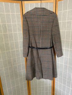 "1970's Juli de aroma houndstooth coat with a blue belt. Belt is made of a faux leather material that, being 50 years old, is now a little sticky to the touch and flakes off in the hand. Missing buttons 2 and 4 and the left pocket buttons. Bust: 40\" Shoulder to hem: 41\"" Retro Belted Fall Outerwear, Retro Belted Outerwear For Fall, Retro Belted Outerwear For Work, Spring Brown Houndstooth Outerwear, Retro Business Outerwear For Fall, Blue Swallow, Houndstooth Coat, Silk Wedding Dress, Blue Belt