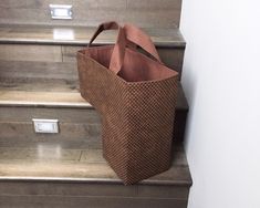 a brown bag sitting on top of some steps