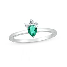 Speak to her inner princess with the tiara-inspired design of this dainty green lab-created emerald and white lab-created sapphire tri-top ring. Crafted in sterling silver This choice glistens with a 5.0 x 4.0mm pear-shaped verdant-green lab-created emerald. A trio of petite shimmering white lab-created sapphires tops the center stone for a tiara-style look. Emerald is the traditional birthstone for May and symbolizes loyalty, faithfulness and love. Verdant Green, Tiara Ring, White Lab, Lab Created Emerald, Peoples Jewellers, Top Rings, Pear Shaped, Tiara, Birthstone