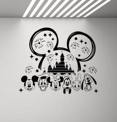 mickey mouse wall decal in the corner of a room with stars and fireworks on it