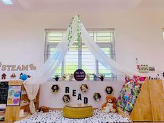 a room filled with lots of books and toys