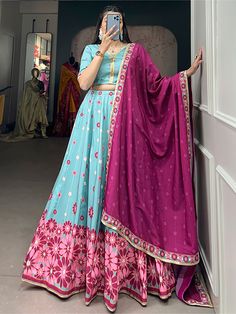 Introducing our stunning "charming sky-blue floral printed silk function wear lehenga choli" set, perfect for all your special occasions. This exquisite ensemble includes a sky-blue lehenga with floral print work and sequin lace border, a matching choli, and a pink maslin silk dupatta with intricate details. Made from high-quality silk material, this set is sure to make you stand out at any event.
This beautiful lehenga choli set is endless. Whether you're attending a wedding, festival, or any o Light Blue Semi-stitched Resham Embroidery Lehenga, Festive Floral Print Choli For Diwali, Festive Diwali Floral Print Choli, Designer Semi-stitched Light Blue Lehenga, Festive Floral Print Choli For Eid, Blue Floral Print Sets For Festivals, Blue Floral Print Festival Sets, Festive Blue Floral Print Sets, Designer Anarkali Lehenga In Light Blue