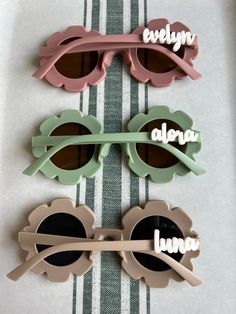 Brand new personalized round flower sunglasses. Perfect summer time accessory.  Personalized acrylic name on one side.  Name will be in white. These glasses are ideal for ages 3-10. 3+ due to small parts that can become a choking hazard model is 2 for size reference Please allow for up to 3 days for shipping but I usually ship next day. Glasses are matte and name is in white gloss. These are the perfect party favor or gift.  Think Flower girl! *since these are personalized and made to order, the Hippy Summer, Summer Glasses, Flower Sunglasses, Themed Activities, Kids Glasses, Round Flower, Boho Kids, Personalized Acrylic, Handmade Brand