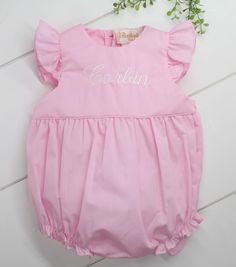 Cute baby girls summer romper outfit by Rosalina is a pink woven one piece bubble outfit that features angel wing sleeves. If you're looking for a monogrammed bubble outfit for summer this personalized baby girls romper is perfect Bubble Romper Outfit, Bubble Outfit, Newborn Hospital Outfits, Bubble Clothes, Summer Romper Outfit, Baby Hospital Outfit, Girls Smocked Dresses