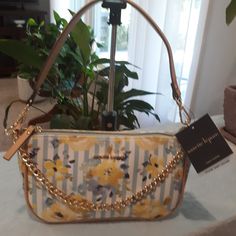 This Bag Is The Most Versatile Bag You Will Own. It Has Trendy Blue And White Stripes With Gorgeous Yellow Flowers. It Has A Decorative Gold Chain Across The Front. It Is Not Detachable. It Is A Handbag If Worn With Just The Chain. Next Is The Leather Detachable Strap. It Turns Into A Shoulder Bag With This. And If You Buy The Bag At Listed Price, I Will Throw In An Unbranded Gold Tone Crossbody Chain. The Chain Is 48 In My Closet Alone. On The Inside Of This Bag Is One Big Slip Pocket And On Th Nanette Lepore Handbag, Own It, Nanette Lepore, Yellow Flowers, Blue Stripes, Gold Chain, Blue Yellow, White Stripe, Vegan Leather