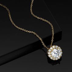 Ross-Simons - 1.00ct t. w. Lab Grown Diamond Halo Pendant Necklace in 14kt Yellow Gold. 18". Set your sights on a dazzling signature style! Our stunning pendant necklace spotlights an .80 carat round brilliant-cut lab-grown diamond with a classic halo of more petite round brilliant-cut lab-grown diamonds totaling .20 carats. Crafted in polished 14kt yellow gold and suspended from a cable chain with a 2" extender. Lab-grown diamonds are identical to mined diamonds according to their optical, phys Classic Halo Diamond Necklace In Cubic Zirconia, Classic Cubic Zirconia Halo Diamond Necklace, Classic Cubic Zirconia Diamond Necklace With Halo, Classic Diamond White Necklace With Halo, Formal Halo Cubic Zirconia Diamond Necklace, Luxury Diamond Necklace With Halo Setting For Formal Occasions, Formal Luxury Diamond Necklace With Halo Setting, Timeless Cubic Zirconia Diamond Necklace With Halo, Timeless Cubic Zirconia Halo Diamond Necklace