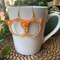 As someone with two orange cats, I can confirm that they are, in fact, like that. Handmade beaded frame earrings featuring Toho seed beads and other various beads. Made with a combination of Fireline and Nymo beading thread, these earrings are sturdy and secure. Made on the traditional and unceded territories of the Qayqayt First Nation, and other Halq'eméylem speaking peoples. Orange Hoop Beaded Earrings As Gift, Orange Beaded Hoop Earrings As A Gift, Orange Beaded Hoop Earrings For Gift, Handmade Orange Hoop Earrings, Orange Beaded Hoop Earrings, Orange Hoop Earrings With Colorful Beads For Gift, Frame Earrings, Beaded Frame, Beading Thread