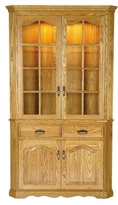 No one will mind getting sent to the corner with the gorgeous Amish Gladstone Full Door Deluxe Corner Hutch - Lifetime Warranty standing there! All joking aside, this wood corner hutch comes to your home from Amish country, where it's built by hand with the materials you select. From the wood to the base style, to the interior lighting option, this wood hutch is custom made for your home.  For Crystal and China What will you use your corner hutch for? These wood storage options are versatile enough to store fine china and crystal or to house books, a home bar and more! The upper cabinet doors have wood mullions carefully cut and hand sanded to perfection. Raised panel doors show off the grain pattern of the wood you select. The two drawers are dovetailed to be the strongest and you can alw Dining Room Corner Cabinet, Amish Hutch, Full Cabinet, Bedroom Furniture Redo, Leaded Glass Doors, Dining Room Corner, Corner Hutch, Cabinet Hutch, Dining Corner