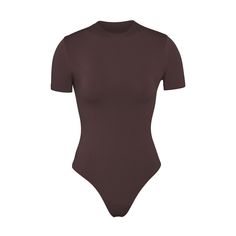 Essential T-shirt Bodysuit | Espresso — A versatile wardrobe foundation that offers light level of compression and smoothing. This bodysuit is made to wear alone or under clothing as the perfect base layer. Under Clothing, Shirt Bodysuit, Versatile Wardrobe, Kpop Girl Bands, Compression Shirt, Girl Bands, Staple Pieces, Base Layer, Trendy Outfits