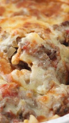 a casserole dish with meat and cheese in it