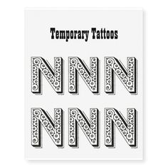 temporary tattoos with the letters n and n in black on a white background, set of four