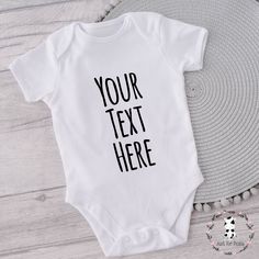 PERSONALISED WHITE BODYSUIT/VEST - AVAILABLE IN LONG OR SHORT SLEEVE AND VARIOUS SIZES AND COLOURS All our vests are finished with high quality vinyl with a lovely soft touch and made from 100% cotton FOR THIS GIFT WE REQUIRE THE DETAILS AS FOLLOWS The text you would like on the vest The more text you have the smaller the text will be. We create personalised gifts for all occasions each with different designs and colours to choose from. Personalised gifts for any occasion Orders are typically dispatched within 1 working days with the free 1st class Royal mail service. We do offer delivery upgrades if guaranteed delivery is required. In the unlikely event we don't receive a message from you at the time of purchase, we will message you afterwards to ask for the details. Please note we won't Fitted Short Sleeve Bodysuit With Letter Print, Fitted Cotton Bodysuit With Crew Neck, Fitted Basic Summer Onesie, Casual Fitted Short Sleeve Bodysuit With Letter Print, Basic Fitted Summer Onesie, Summer Basic Fitted Onesie, Fitted Cotton Basic Onesie, Basic Cotton Bodysuit With Crew Neck, White Short Sleeve Cotton Bodysuit