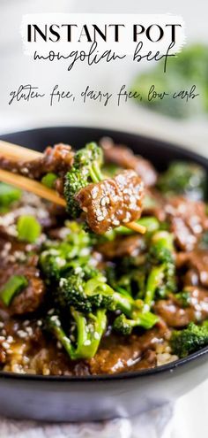 beef and broccoli stir fry in a skillet with chopsticks on the side