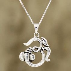 Crafted from sterling silver, the symbol for the meditative mantra om forms the pendant of this necklace from India. Neetu Barathi designs this accessory, which circles the neck with sterling cable chain. Ganesha Pendant, Om Pendant, Celtic Necklace, Sterling Silver Necklace Pendants, Gold Wedding Band, Silver Pendant Necklace, Jewelry Gift Box, Sterling Silver Pendant, Dress Shirts