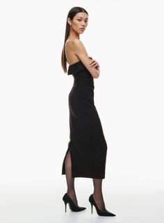 This is a lined strapless dress designed for a slim fit. It's cut from structured, subtly textured crepe that has a touch of stretch for shape retention and hold. Invisible back zip Back vent for ease of movement Formal Fitted Off-shoulder Bandage Dress, Strapless Lined Bodycon Dress, Strapless Bodycon Lined Dress, Sleek Off-shoulder Bodycon Dress For Formal Events, Elegant Fitted Bandeau Strapless Dress, Evening Strapless Bandage Dress With Fitted Bodice, Party Midi Dress With Straight Neckline And Lining, Lined Off-shoulder Evening Dresses, Fitted Strapless Dress With Straight Neckline For Gala