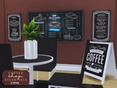 a coffee shop with menus and chairs in front of the table, along with a potted plant