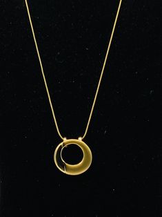 Round gold tone necklace by Lia Sophia Elegant Gold Metal Charm Necklaces, Elegant Gold Metal Charm Necklace, Modern Gold Metal Charm Necklaces, Modern Gold Pendant Chain Necklace, Modern Gold Metal Charm Necklace, Elegant Gold Chain Necklace With Large Pendant, Elegant Gold Necklace With Large Pendant, Modern Gold-tone Clavicle Chain Necklace, Elegant Gold Medallion Necklace With Adjustable Chain